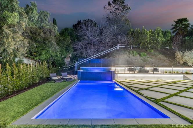 Swimming pool and surrounding deck in the rear yard of the Gloucester Lane property in Thousand Oaks